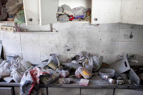 A destroyed kitchen inside a Kiryat Malachi house where three Israelis were killed when it was hit by a rocket fired from Gaza, 15 November. It was the first fatal rocket fired from Gaza so far this yea