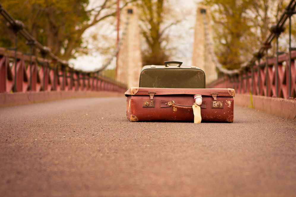 Suitcases on bridge