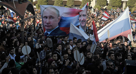 syrian parade with putin and assad banners
