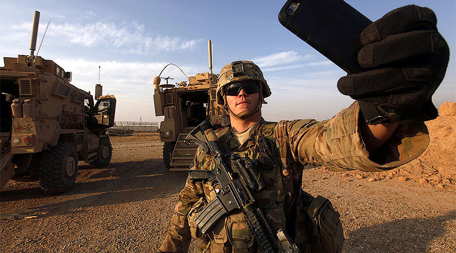 American soldier takes a selfie at the U.S. army base in Qayyara