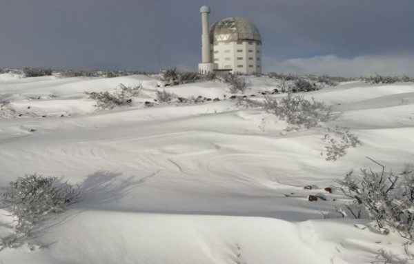 The SALT Observatory in Sutherland is surrounded by snow.