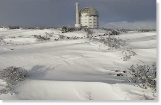 The SALT Observatory in Sutherland is surrounded by snow.