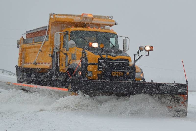 Above, a Nova Scotia Department of Transportation and Infrastructure Renewal plow clears a bridge, located at the top of Upper Prince Street in Sydney, that crosses Highway 125 just south of the Grand Lake Road intersection.