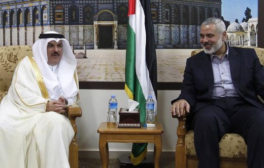 Head of the Hamas government in the Gaza Strip, Ismail Haniya (R), meets with the head of a Qatari delegation Mohammed al-Emadi in Gaza City on 25 September 2012 