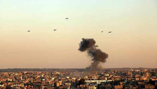 Smoke rises over Gaza City after an Israeli air strike, 15 November