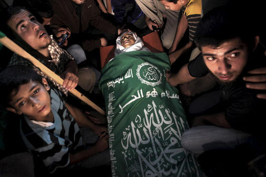 Thirteen-year-old Ahmad Abu Daqqa is mourned during his funeral in Abbassan al-Kabira, east of Khan Younis in the southern Gaza Strip, 9 November. The boy was shot in his stomach by an Israeli soldier while playing football outside his home